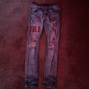 Distressed Blue Jeans with Red Lettering